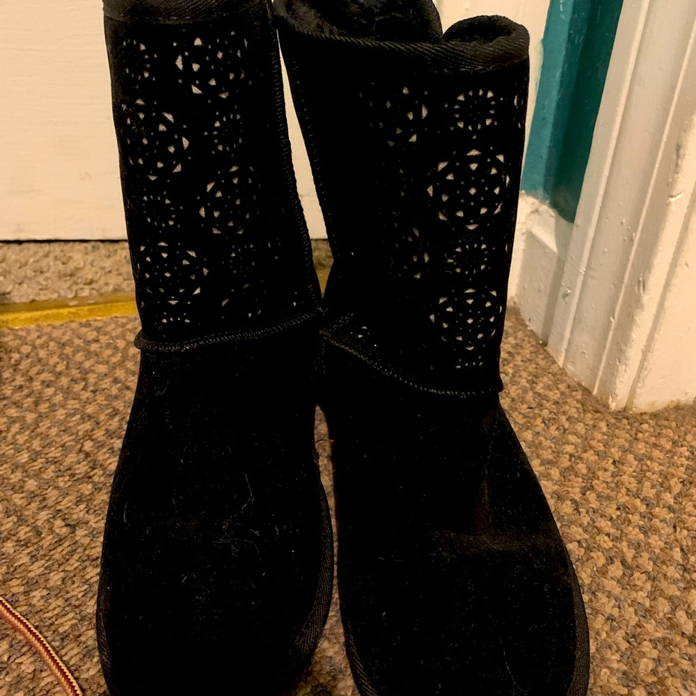 Black flat boots ,with stylish decor going-up the front of the boots